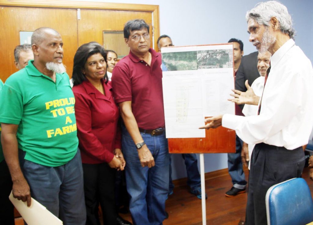 NO TO HOUSING: Environmental activist Wayne Kublalsingh, right, meets with Shiraz Khan, left, Dhano Sookoo, of the Agricultural Society, 2nd from left, and Evan Ramkhalawan yesterday at the OWTU headquarters in 
San Fernando.