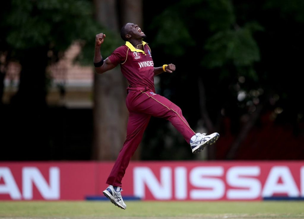 Carlos Brathwaite celebrates a wicket during the World Cup qualifying tournament.