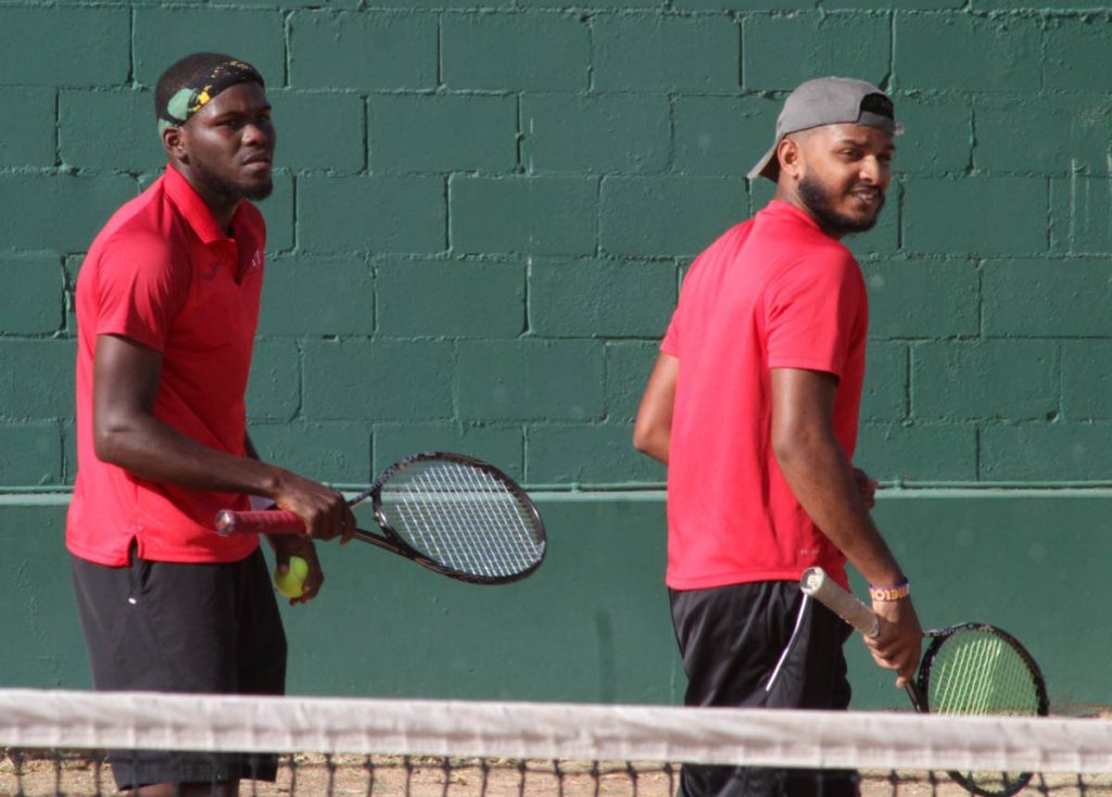 Vaughn Wilson (left) and Nabeel Mohammed in action at yesterday’s men’s doubles final.