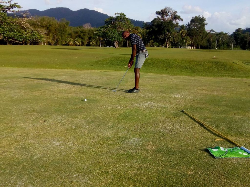 Former TT and Defence Force footballer Criston Baptiste putts during the 2018 Chaguaramas Club Championship yesterday. PHOTO COURTESY VIDIA RAMPHAL.