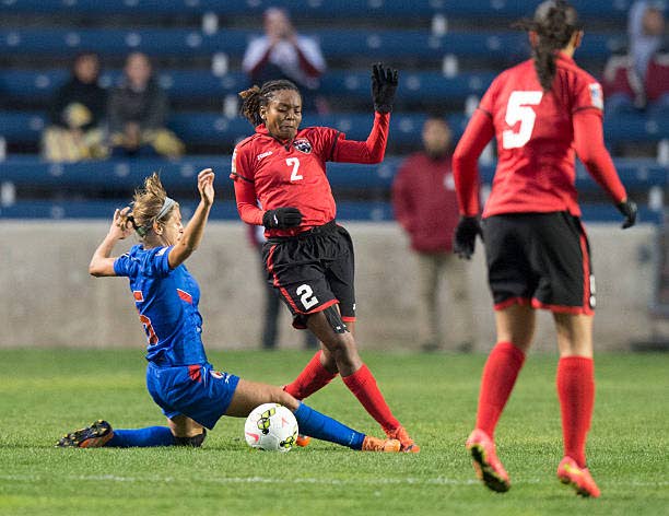 Ayana Russell (centre) in action for Trinidad and Tobago against Haiti in a recent encounter.