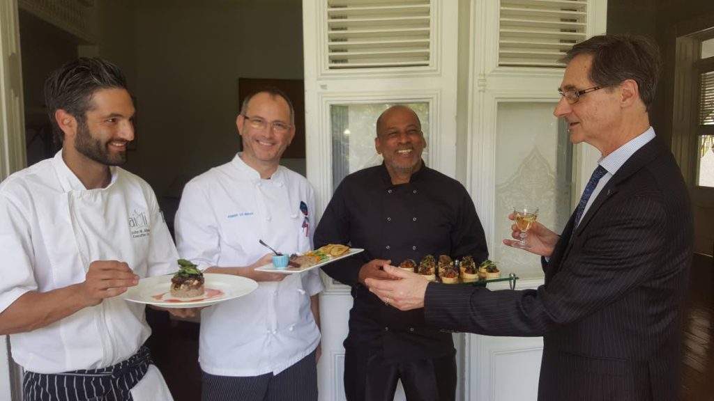 French Ambassador Serge Lavroff at right, gets samples of dishes from participating Chefs John Aboud (Aioli) from left, Pierre Le Bihan (AzAou) and Moses Ruben (Mélange)