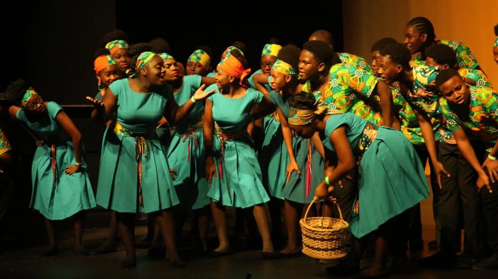 WINNING PERFORMANCE: Students of the  Scarborough Secondary School perform in the Secondary Folk Song Choir at the 32nd biennial Music Festival yesterday at Naparima Bowl in San Fernando.
 PHOTO BY VASHTI SINGH