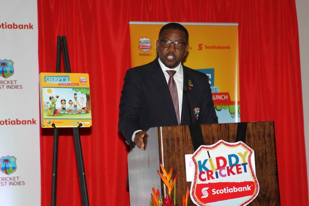 WICB president Dave Cameron speaks yesterday during the launch of the Scotiabank Kiddy Cricket Academic Manual launch held at the Hyatt Regency, Port of Spain.