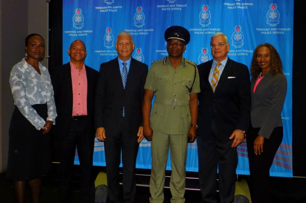 Head of Corporate Communications for the Police Service Ellen Lewis, left, Chairman of Digicel Imax Brian Jahra, Port of Spain Mayor Joel Martinez, Ag Commissioner of Police Stephen Williams, President of the Downtown Owners and Merchants Association Gregory Aboud and Digicel Imax Ingrid Jahra pose for a picture during yesterday's viewing of the Black Panther