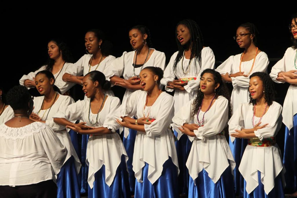 GIRLS CAN SING: Students of St Joseph Convent, San Fernando during their winning performance yesterday at the 32nd biennial Music Festival championships at Queen’s Hall in St Ann’s. PHOTO BY RATTAN JADOO