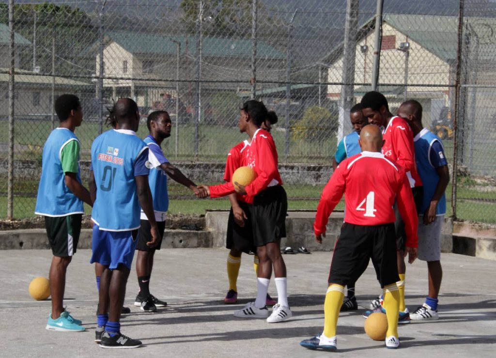 Futsal friendly: Maximum Security Prison (MSP) and Remand Yard inmates exchange greetings before a game of futsal at MSP in Arouca. PHOTOS BY ROGER JACOB