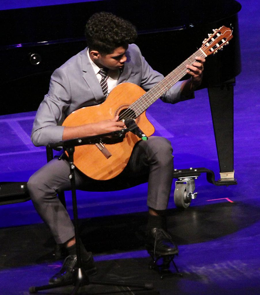 STRUM IT: Aaden Adams won the Miguela Gonzales trophy yesterday at the Music Festival in the Piano Solo (Juniors) at Queen’s Hall.