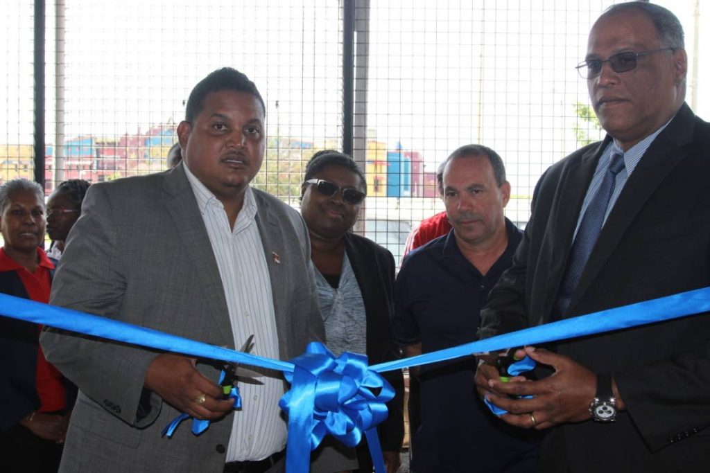 Minister of Sport and Youth Affairs Darryl Smith and chairman of the TT Boxing Board of Control Dr Barry Ishmael, cut the ribbon to officially open the new office location of the TTBBC, at the Hasely Crawford Stadium, Mucurapo, on Friday.