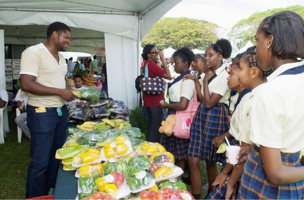 Students interact at a previous UWI, St Augustine Agri Expo. This year’s show begins on Thursday and ends three days later.