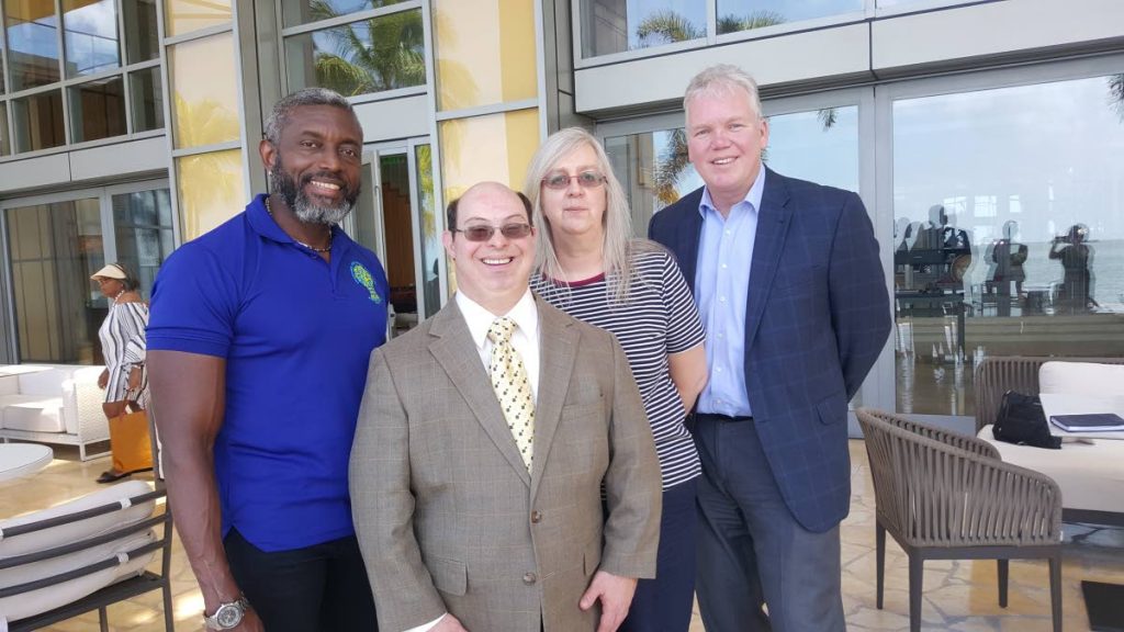 David Egan, global advocate for persons with disabilities second from left, is here with Glen Niles, TT Downs Syndrome Family Network, from left, Penny Green and David Thomason, Vice President of Advancement, Special Olympics - Virginia