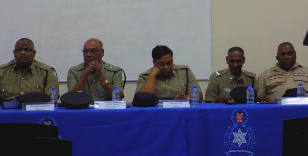Left to Right Ag Supt for the Western Division Ramnarine Samaroo, Snr Supt Neville Sankar, Ag ACP Beverly Lewis, ASP Maharaj and Asst Supt Raymond Thom sit during a police town hall meeting at the Paramin RC School on Wednesday night.