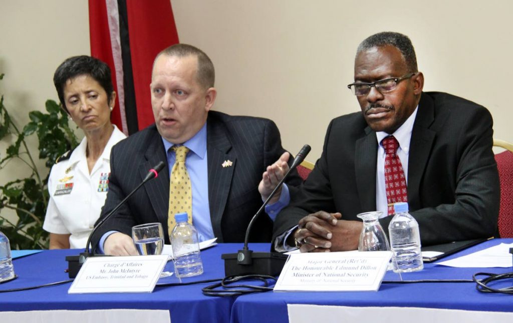MILITARY TALKS: National Security Minister Edmund Dillon (right), US Embassy Chargé d’Affaires John McIntyre and US Chief Military Liaison Officer Claudia Carrizales at the launch of  bilateral military exercise Fused Response 2018  at the Ministry of National Security,Temple Court, Abercromby Street, Port of Spain yesterday.  PHOTO BY SUREASH CHOLAI