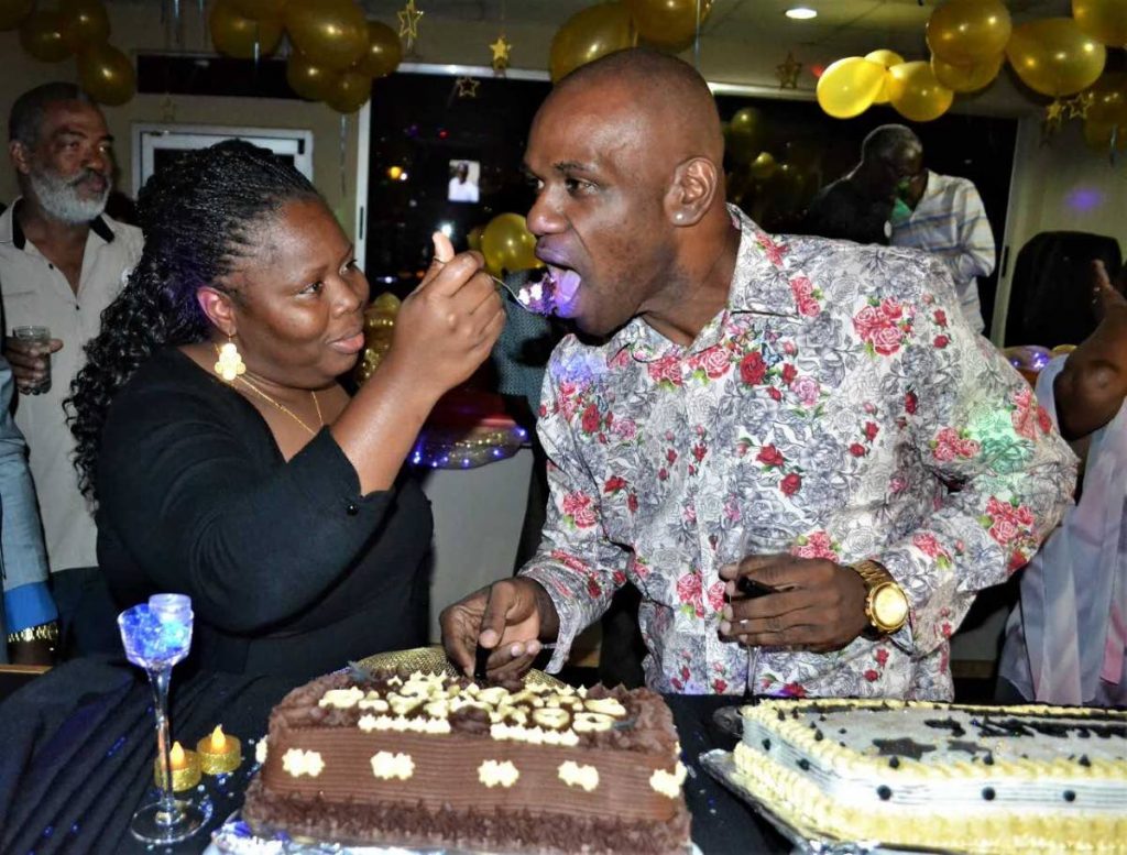 BP Renegades captain Candice Andrews-Brumant share cake  with arranger Duvone Stewart  in the Media 21 booth at the Queen's Park Oval, Tragarete Road, Port of Spain. 