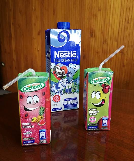 Nestlé Full Cream Milk, made with 100 per cent local cows milk, is flanked by the new, smaller sized packs of Nestlé  Orchard Fruit Punch and Apple Cherry Drink juices. PHOTO BY SASHA HARRINANAN. MARCH 12, 2018