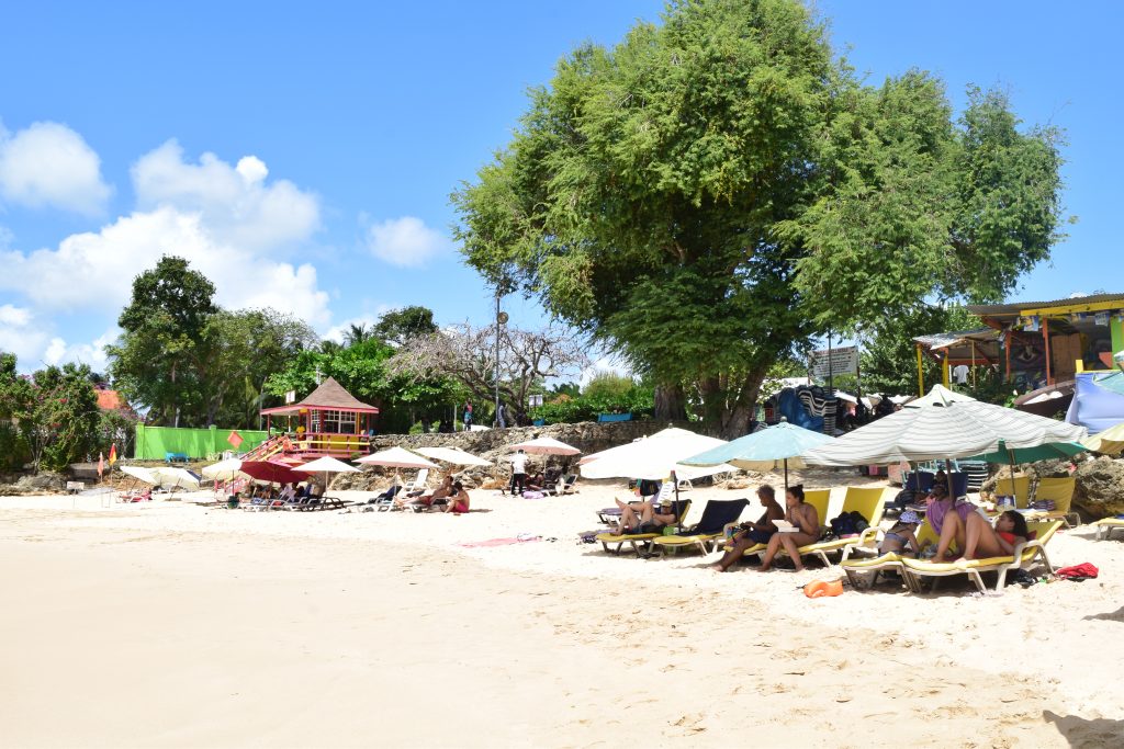 Beachgoers relax on the popular Store Bay in Tobago. Hoteliers on the island are reporting dismal occupancy rates for the usually busy Easter season. PHOTO BY Vidya Thurab