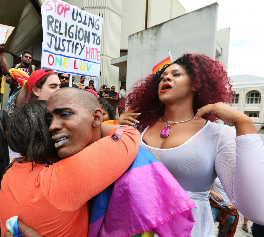 TEARS OF JOY: Gay rights activists were moved to tears outside the Hall of Justice in Port of Spain yesterday after a High Court judge declared the law against buggery was a violation of human rights.
PHOTO BY AZLAN MOHAMMED