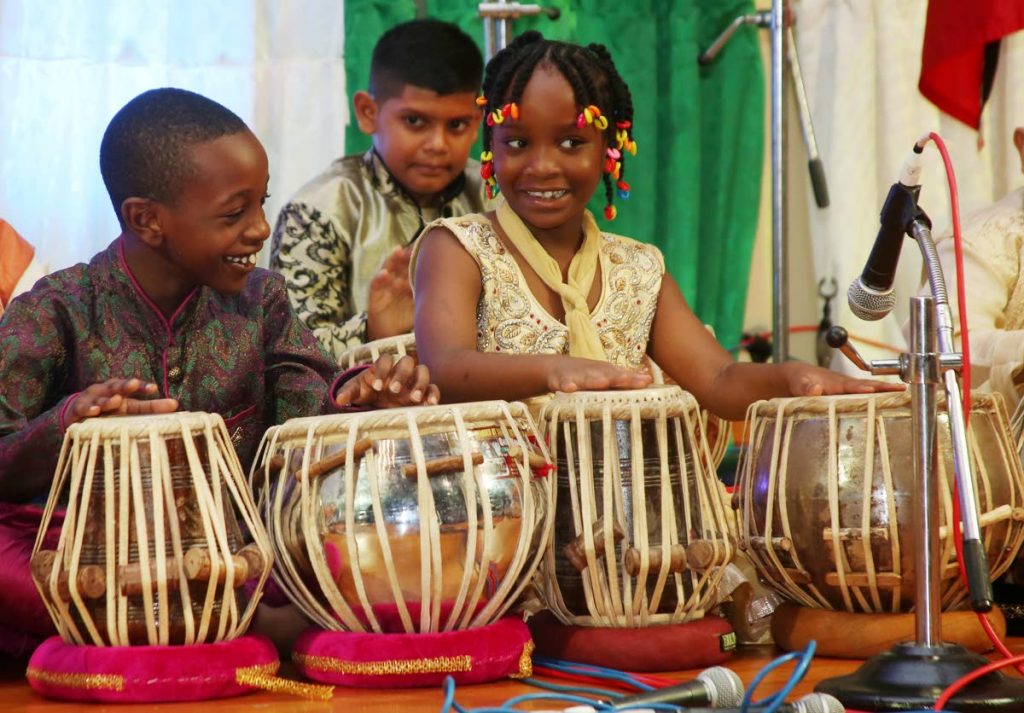  Tabla talent: Sean Efemera Johnson and his sister Anaborhi enjoy playing the tabla at the Kala Sandhya hosted by the Mahatma Gandhi Institute of Cultural Cooperation at the Chaguanas Borough Corporation on March 13. 
