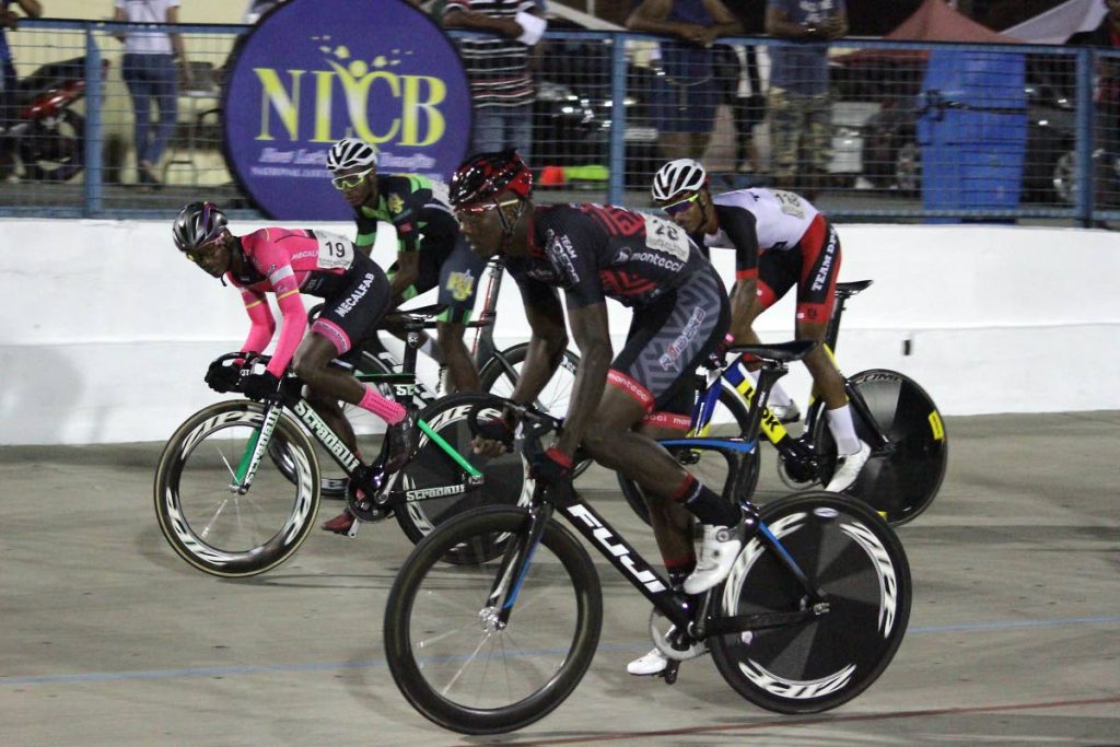 In the Men’s Elite I race, Jamol Eastmond, in pink and black kit, of Heatwave leads the pack during action in the Easter Cycling Classic at the Arima Velodrome, on Friday.
