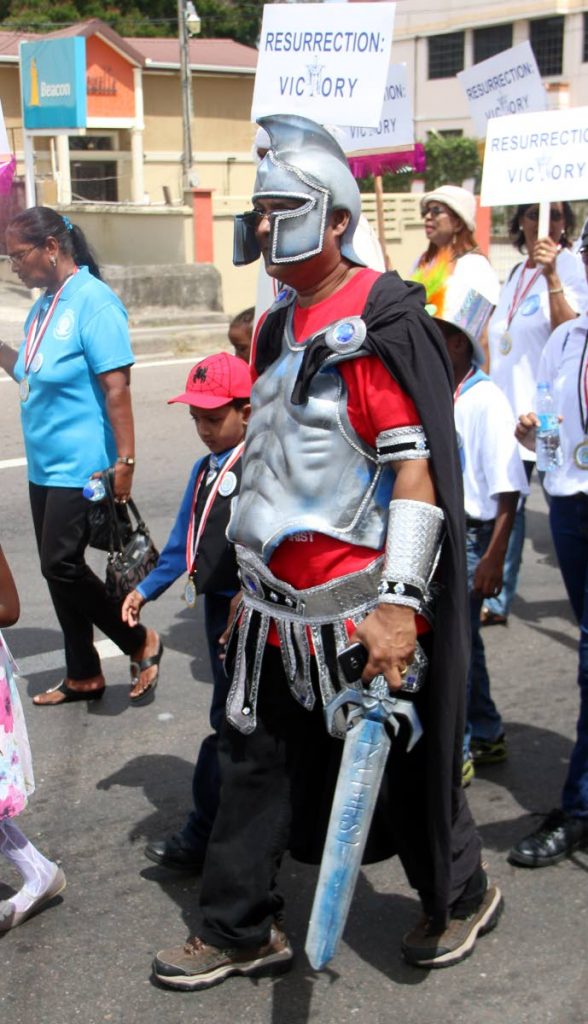 A man, dressed as a Roman soldier takes part in the Presbyterian Church’s first Resurrection Victory National Easter Parade yesterday at Naparima Boys College in San Fernando.