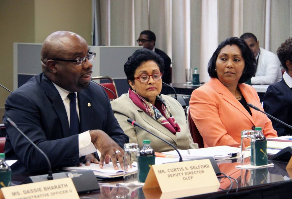From left, Curtis Belford, from the Office of Law Enforcement Policy; National Security Ministry Permanent Secretary Vashti Singh and Ag Chief Immigration Officer Charmaine Gandhi-Andrews  at the Joint Select Committee meeting in the Parliament Tower, Port of Spain in April.