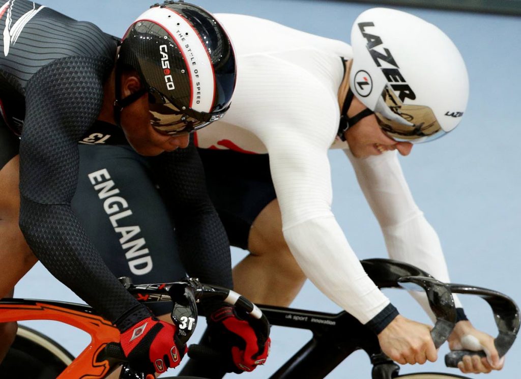 Trinidad and Tobago’s Nicholas Paul, left, and England’s Ryan Owens compete during the Men’s Sprint heats at the Anna Meares Velodrome during the Commonwealth Games in Brisbane, Australia, yesterday.