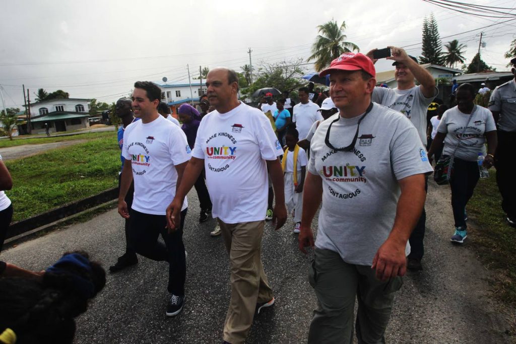 Chaguanas East MP Fazal Karim joins members of the Enterprise community for their peace march. Photo: Lincoln Holder.