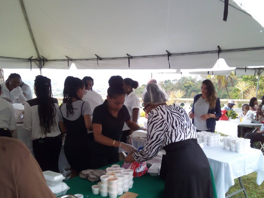 Volunteers share brunch boxes at the St Vincent De Paul Charity Brunch at the Mt St Benedict Seminary, yesterday.