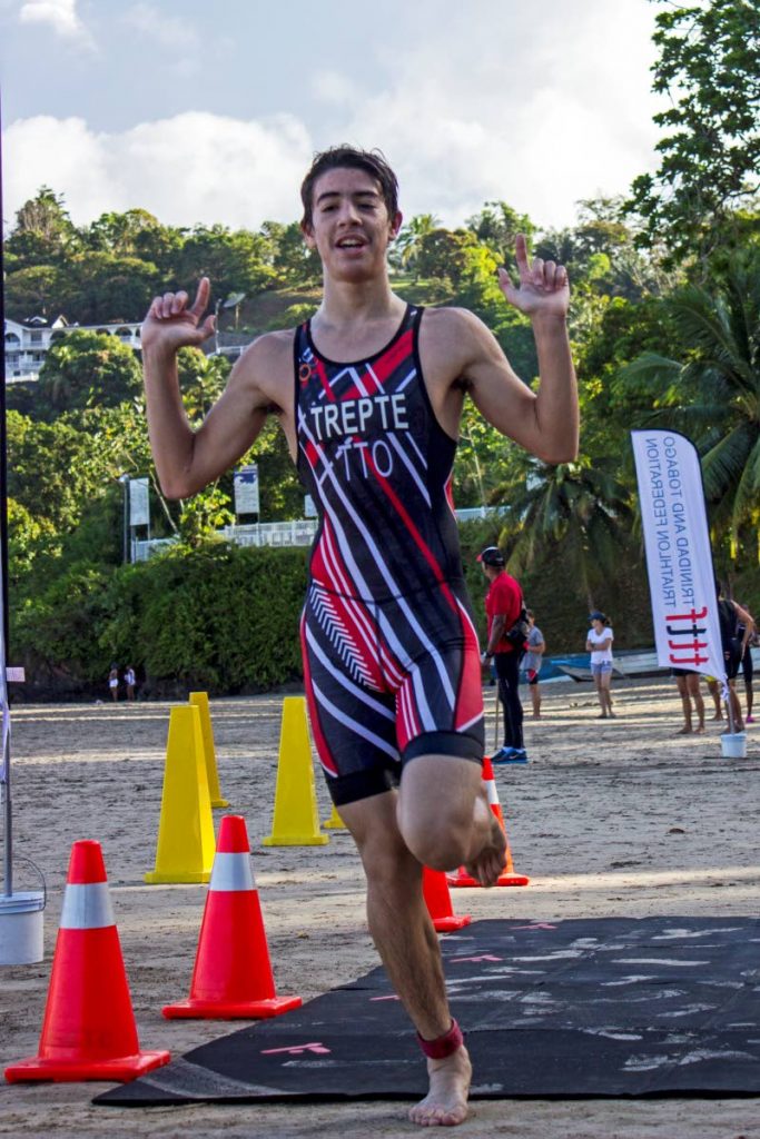 Liam Trepte signals he’s number one in his age group on Sunday at the National Aquathlon Championships.
