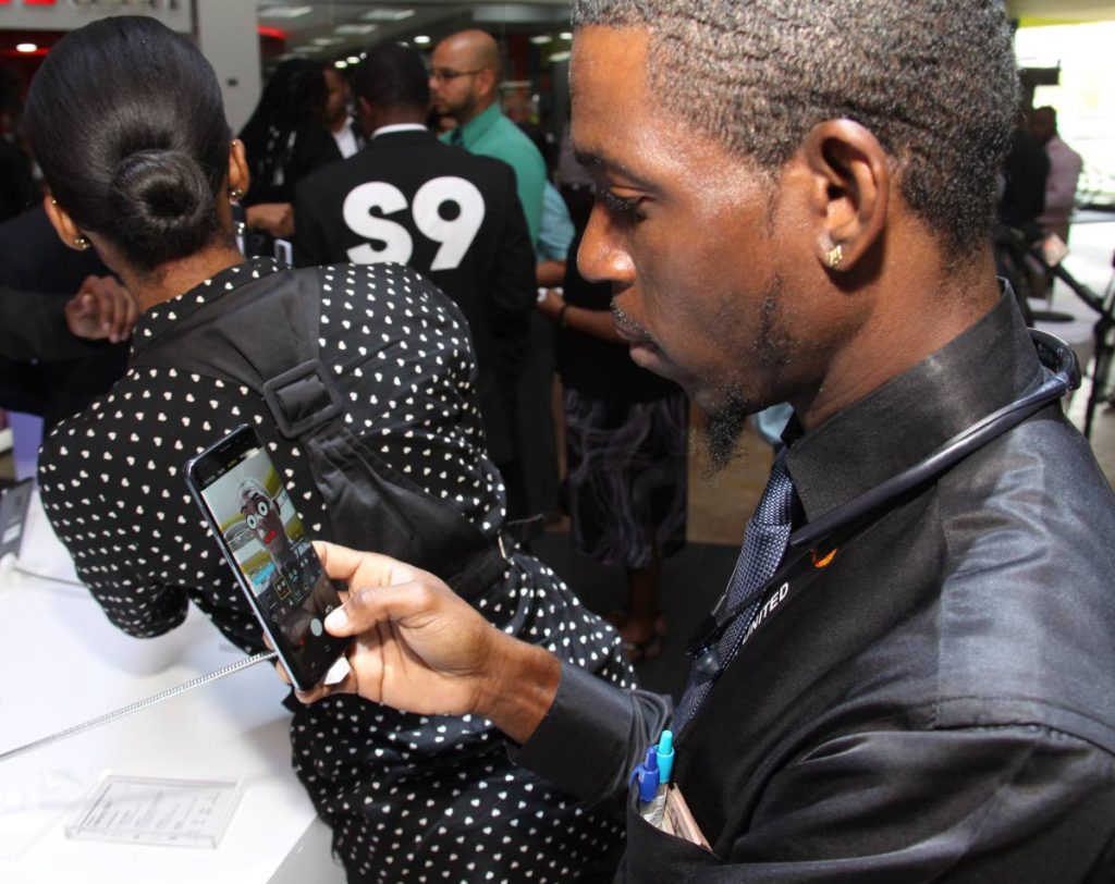 A Samsung user tries out the augmented reality emoji at the launch of the S9 at Trincity Mall last Thursday.