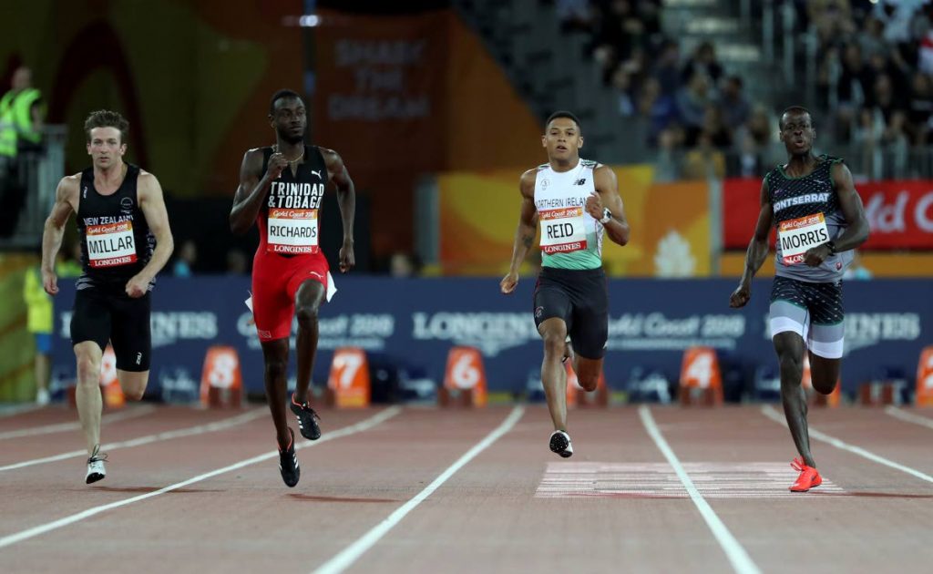 TT’s Jereem Richards, second left, leads the field to the finish line to win his men’s 200m semifinal at Carrara Stadium during the 2018 Commonwealth Games on the Gold Coast, Australia, yesterday. (AP Photo)