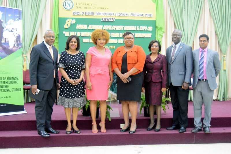 Trade and Industry Minister Paula Gopee-Scoon, 2nd from left, Community Development Minister Dr Nyan Gadsby Dolly, 3rd from left, and senior representatives of the USC during the seminar.