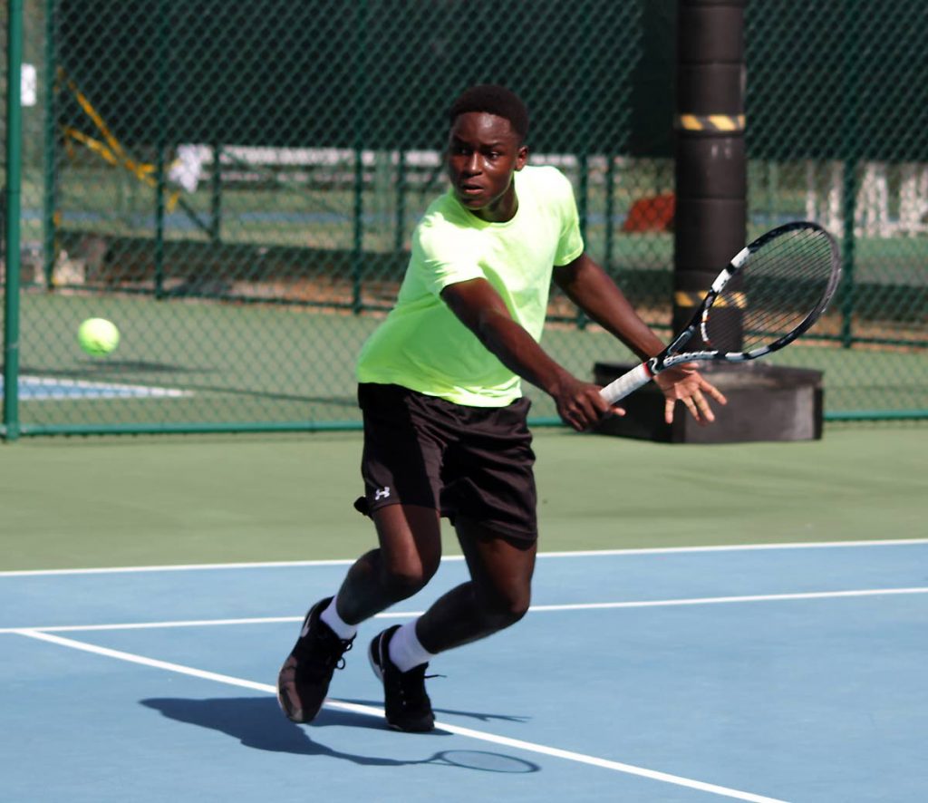 TT’s Kobe James in action during a Trinidad Trinity Cup 2018 Mens Doubles match yesterday at the National Racquet Centre, Tacarigua.