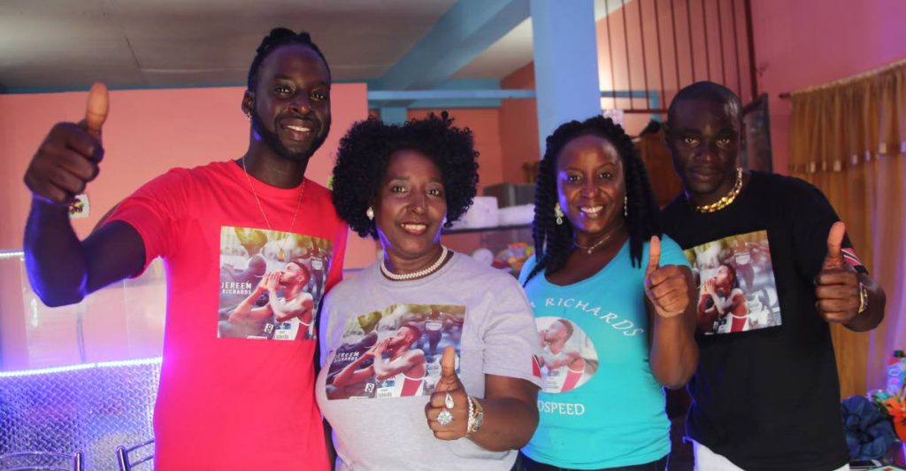 ALL IN THE FAMILY: The relatives of newly crowned Commonwealth 200m champ Jereem Richards celebrate in point Fortin yesterday. (From left) Jereem’s brother Kevon Richards, his mother Yvette Wilson, his aunt Joy Wilson Peterson and Jason Hercules.