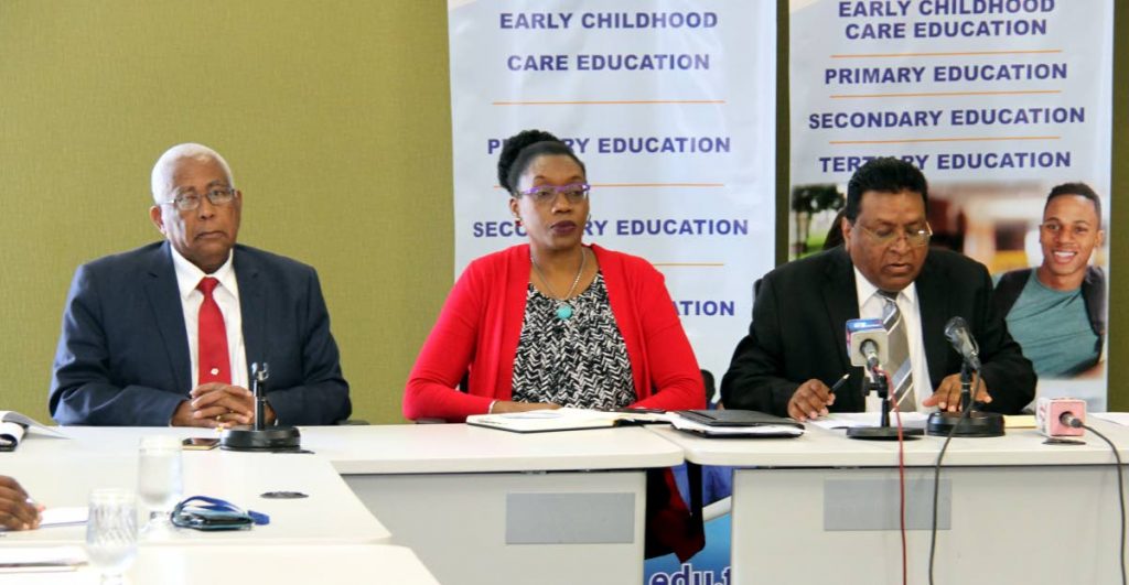 SCHOOL TALK: Education Minister Anthony Garcia, permanent secretary Lenore Baptiste-Simmons and Chief Education Officer Harrilal Seecharan at a news conference yesterday.
