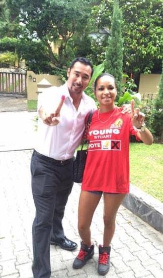 RED AND READY: This photo, posted to social media, shows Stuart Young with her then stepdaughter Krystiana Sankar in the run up to the 2015 General Election. Sankar was kidnapped on Thursday and released yesterday after two ransoms totalling $167,000 were paid.