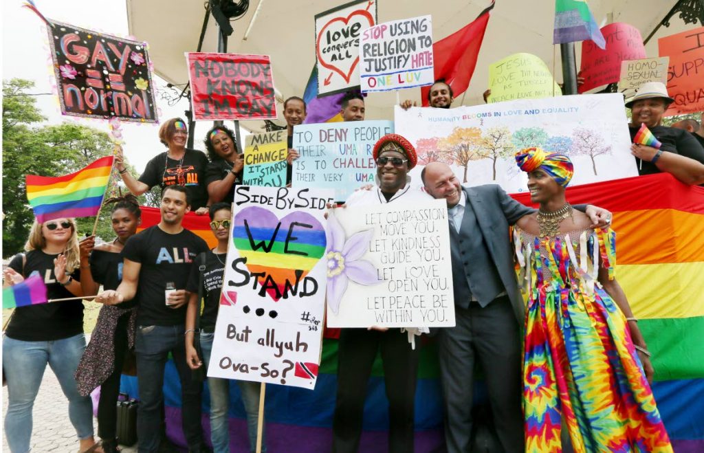 File photo: Members of the LGBTQI community celebrate with gay rights activist Jason Jones at Woodford Square, 
last Thursday, after a High Court judge ruled this country’s buggery laws were “unconstitutional.”