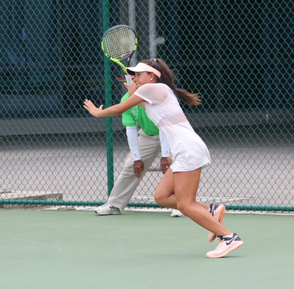 USA's Sopfia Rojas chases a return against Sasha Wood, during a match for the Bmobile Trinity Tennis Cup, at the National Racquet Centre, Tacarigua yesterday. 