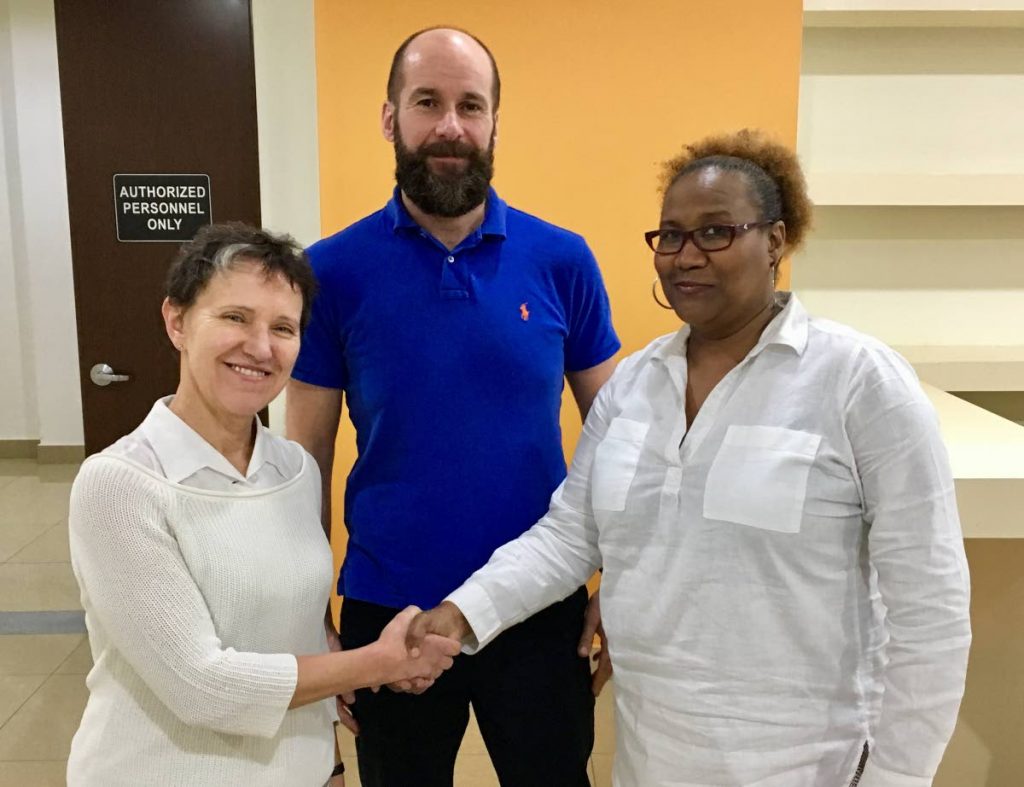 TT Pro League interim CEO Julia Baptiste (right) extends gratitude to Eva Pasquier (left), head of international relations at UEFA, while UEFA ASSIST’s Kenny MacLeod looks on following a recent UEFA ASSIST-Trinidad workshop at the National Cycling Velodrome in Couva. PHOTO COURTESY TT PRO LEAGUE