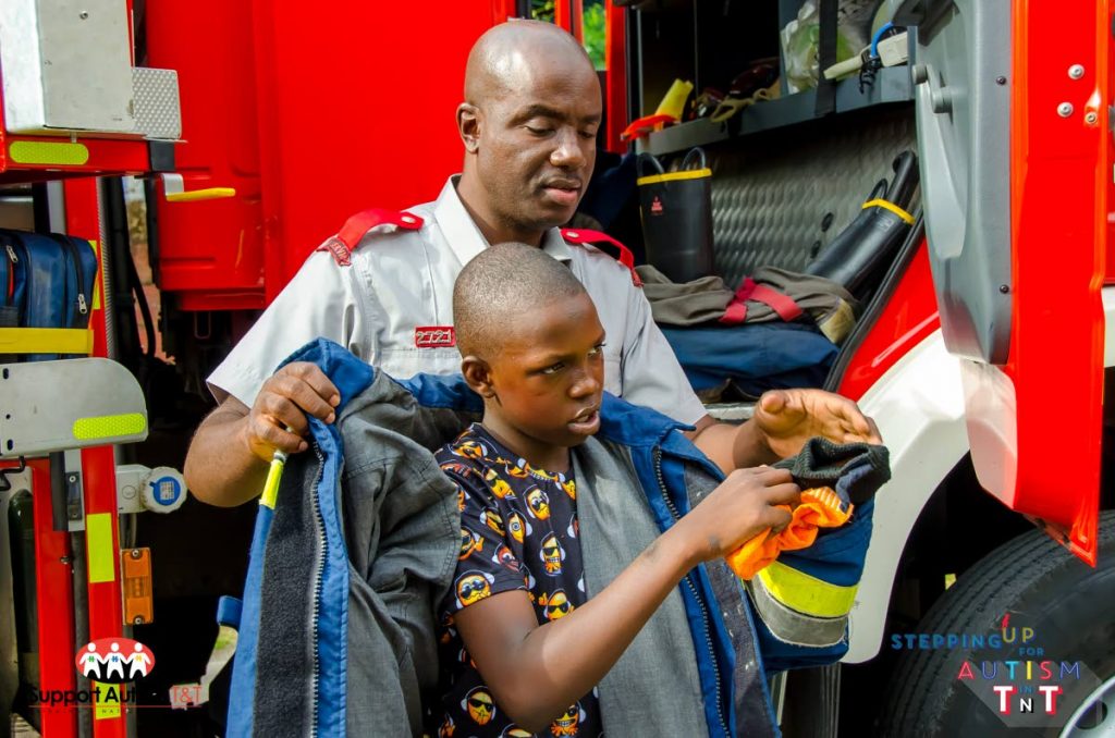 Fire officers interact with children with autism and their families. Photos by Keegan Callender