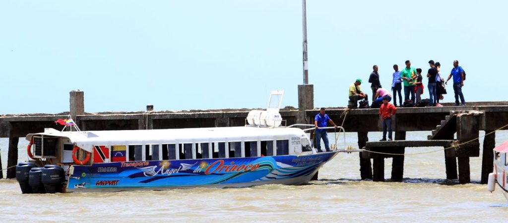 The water taxi, Angel del Orinoco, which transports people between Venezuela and Trinidad is docked at the Cedros port yesterday.   PHOTO BY ANSEL JEBODH