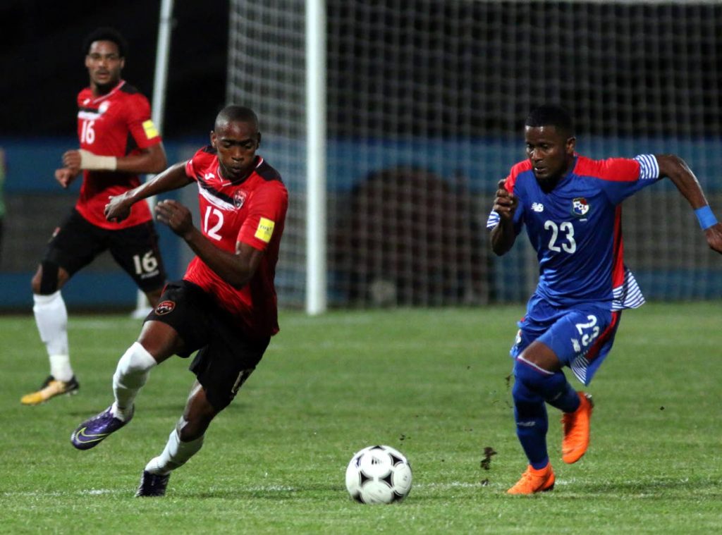 TT’s Reon Moore,left, and Panama’s Sergio Ortega vie for the ball during an international friendly, on Tuesday, at the Ato Boldon Stadium. Panama won 1-0. PHOTO BY ANSEL JEBODH