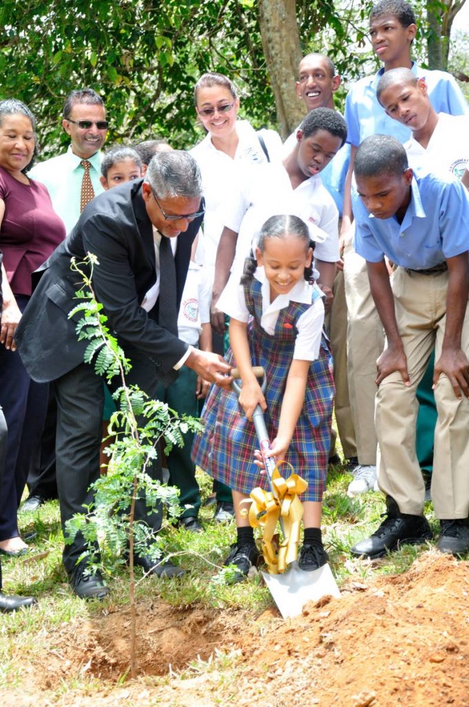 Agriculture Minister Clarence Rambharat assists 4H
Students in planting a tamarind tree following a Tree Planting Ceremony hosted by the World Food Day National
Committee of Trinidad and Tobago and Massy Stores at the Royal Botanic Gardens, Port of Spain on Wednesday.