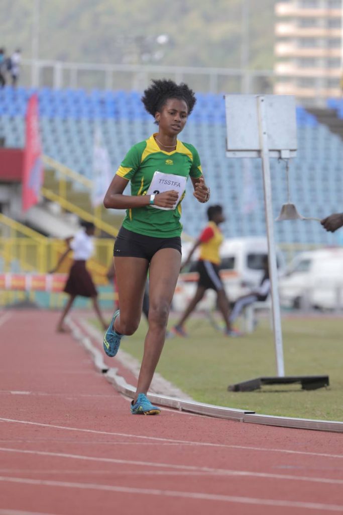Camille Lewis of Sangre Grande Secondary on her way to winning the girls over-17 1500m on Day One of  2018 TT Secondary Schools Track and Field Championships at the Hasely Crawford Stadium, Mucurapo yesterday.