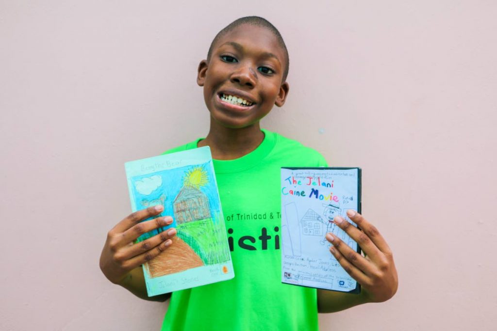 Big dreams: Jelani Caine, who is autistic, displays a book he has written and the case he has created for his yet to be made animation DVD, The Jelani Caine Movie. The 11-year-old dreams his cartoons will one day air on Cartoon Network, Nickelodeon and Boomerang. 