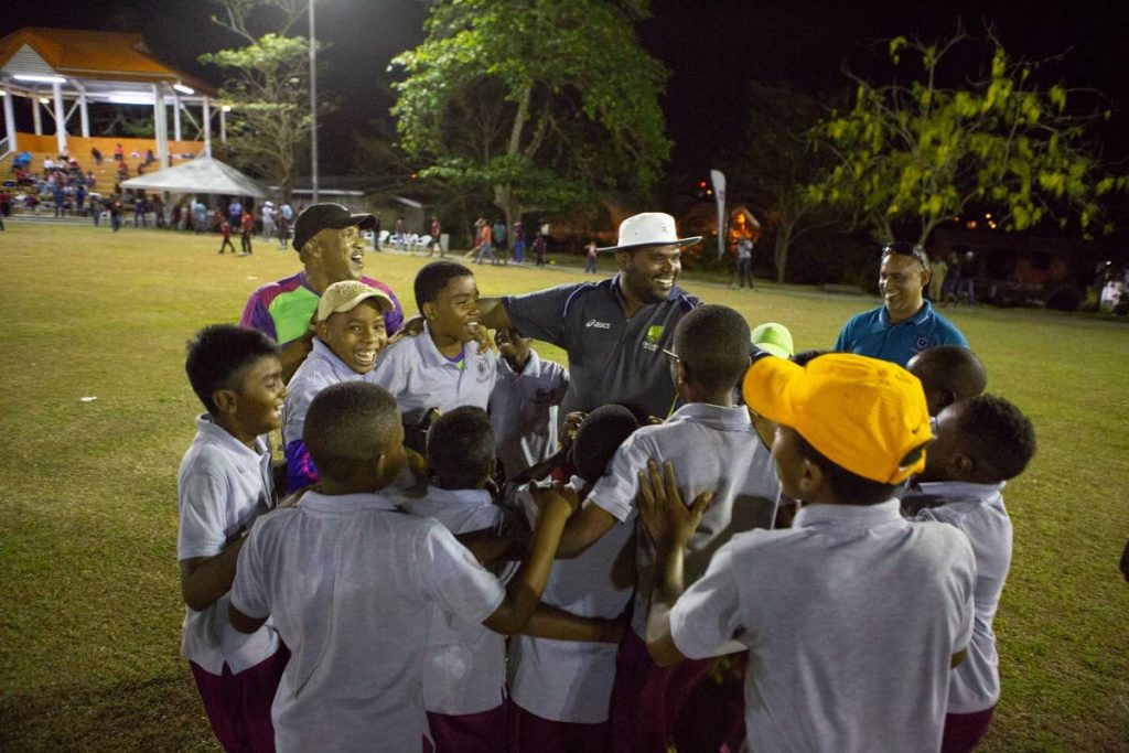 Montrose Government coach Ishwar Ramnath and his players enjoy their one-run win over Rochard Douglas Presbyterian in the opening exhibition match of the 2018 Atlantic National Primary Schools Cricket League, Friday, in Barrackpore.