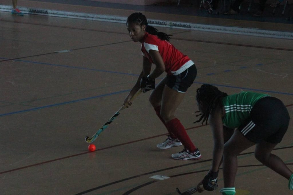 A Paragon player looks to make a play against Ventures in the UWI Indoor Hockey Invitational women’s final.