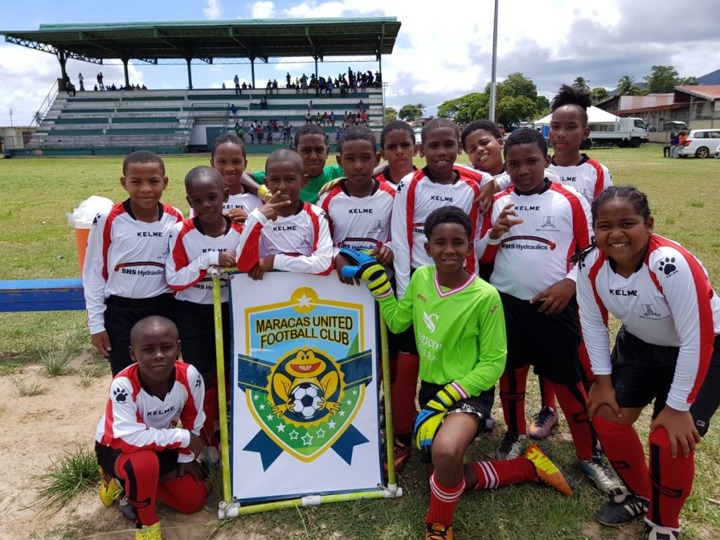 SWEET VICTORY: Maracas United FC players enjoy their first win of the Republic Youth Football League on Saturday at Constantine Park, Macoya.