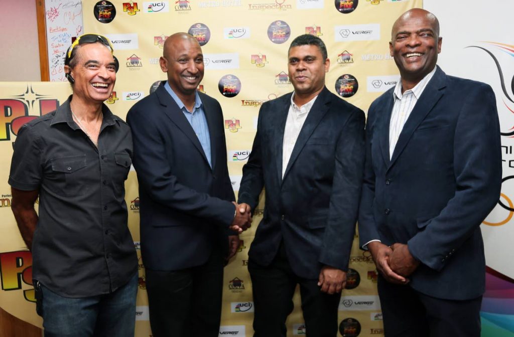 President of the TT Cycling Federation Robert Farrier, second from left, shakes hands with Mukesh Ramsingh of Metro Hotel, while PSL CEO Desmond Roberts, right, and cycling icon Gene Samuels, left, looks on at the PSL Fire on Wheels launch at TTOC headquarters, Abercromby Street, Port of Spain, yesterday.
All smiles is from left while TTCF president Robert Farrier.