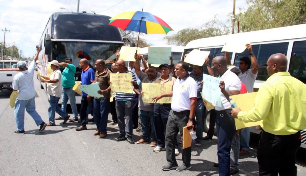 HALT: Maxi taxi drivers protest over four months of no payment for transporting school children. The protest took place at Kings Wharf in San Fernando. PHOTO: Ansel Jebodh